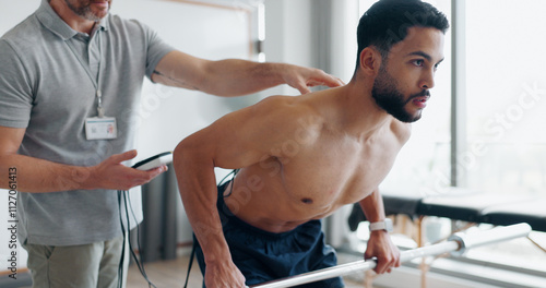 Принти на полотні Physiotherapy, training and monitor with man in clinic for biofeedback, muscle stimulation and track progress