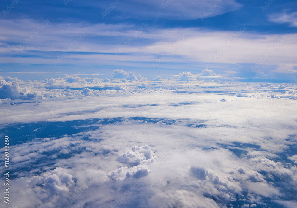 Cloudscape, Colored Clouds at Sunset near the Ocean. View from Plane Cloudscape, Colored Clouds at Sunset near the Ocean. View from Plane