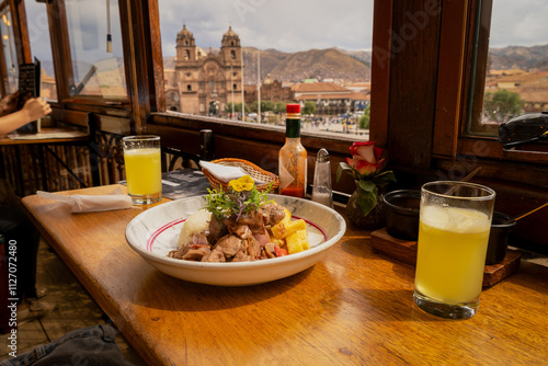 Bild auf Leinwand Alpaca loin with mushroom cream overlooking the Cusco square, Peruvian food