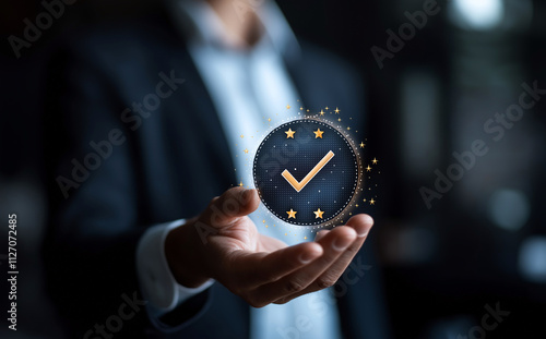 Wallpaper Mural person holding virtual badge with check mark, surrounded by glowing stars, symbolizes achievement and success. This conveys sense of accomplishment and recognition Torontodigital.ca