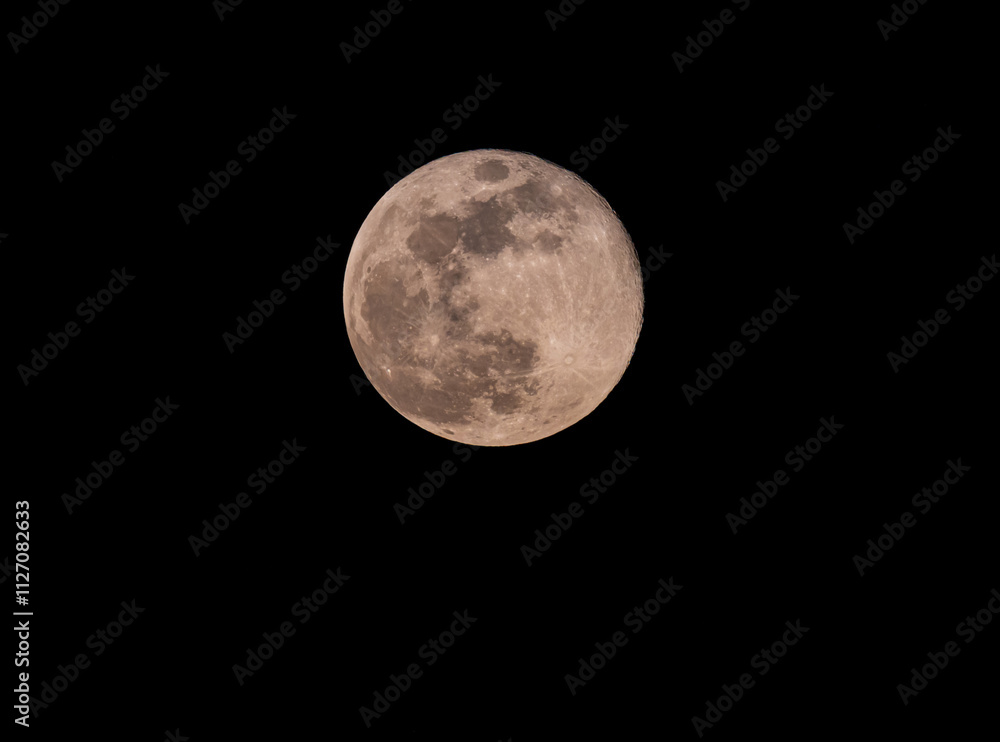Close up of full moon on the dark night seen with the lens super Close up of full moon on the dark night seen with the lens super