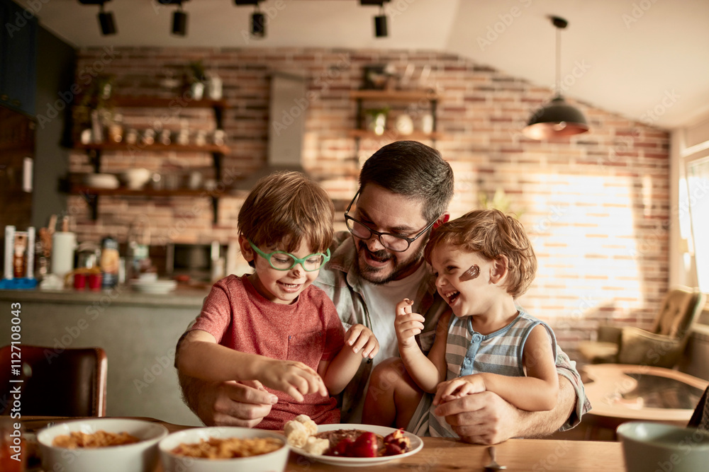 Father and kids enjoying messy pancake breakfast together Father and kids enjoying messy pancake breakfast together