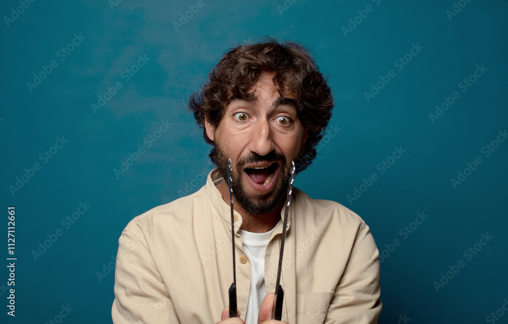 Obraz premium young adult bearded man cooking concept
