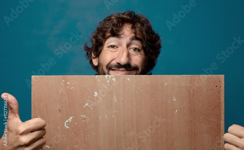 young adult bearded man with a wood copy space photo