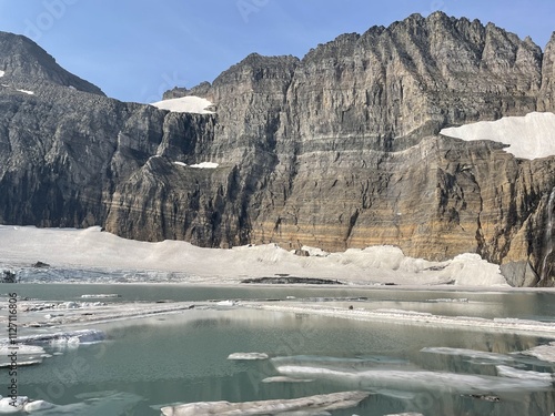 Grinnell Glacier in Glacier National Park with a glacier water ice and snow and rock formation   photo