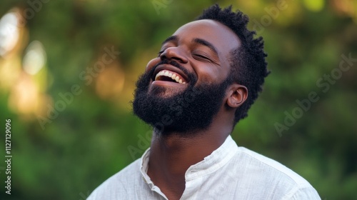 Joyful moment captured in nature with a smiling man outdoors