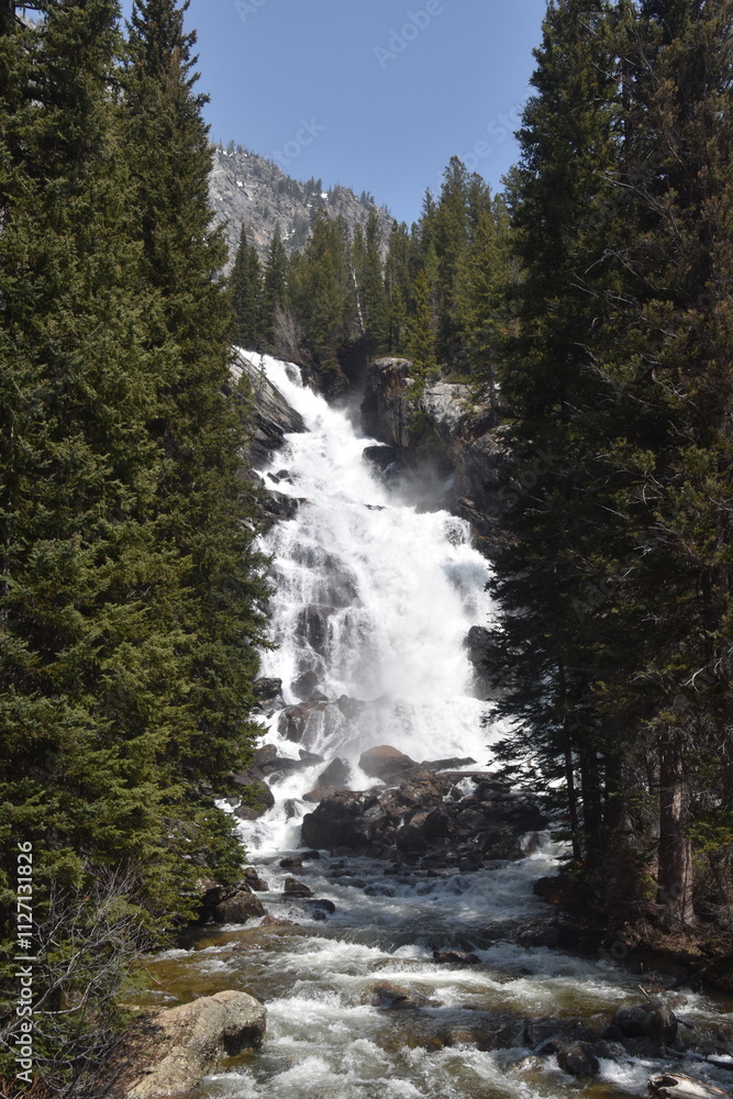 Hiking in the stunning mountain and lake scenery in the Grand Teton National Park, Wyoming Hiking in the stunning mountain and lake scenery in the Grand Teton National Park, Wyoming