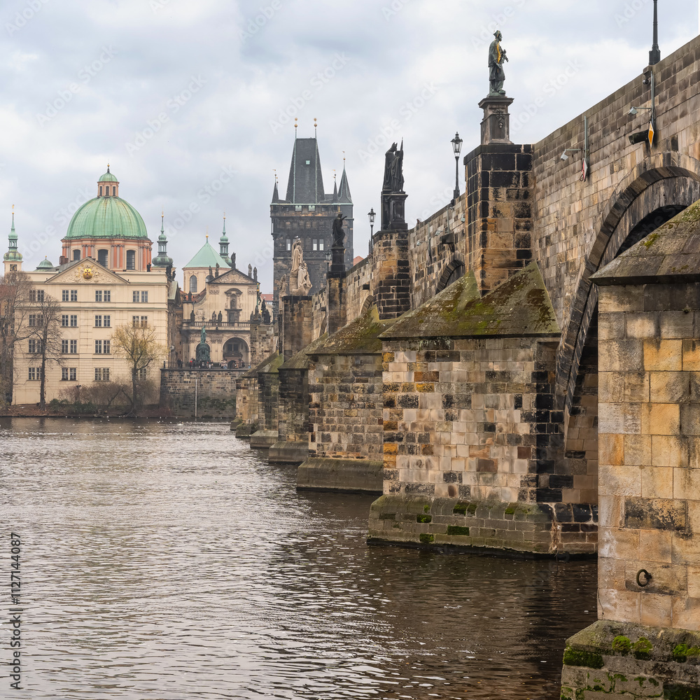 Fototapeta premium Old Charles Bridge crossing the Vltava River in the UNESCO city of Prague, Czechia.