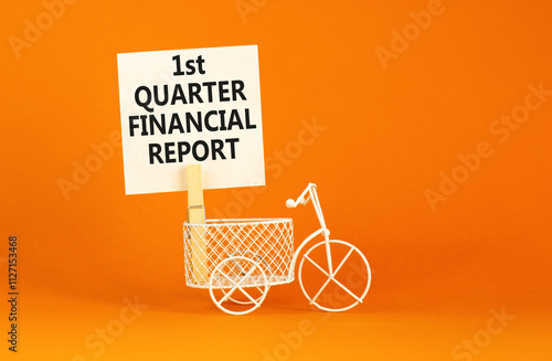 1st quarter financial report symbol. Concept words 1st quarter financial report on beautiful white paper. Beautiful orange background. Business 1st quarter financial report concept. Copy space. photo