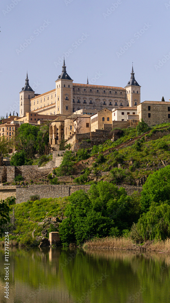 Vertical view of the Alcázar of Toledo with its surrounding hillside and river Vertical view of the Alcázar of Toledo with its surrounding hillside and river