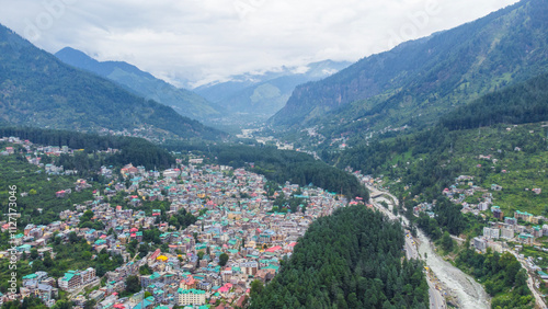 Aerial view of manali with the beas river in himachal pradesh India. Himalayan mountains and colourful local houses nestled in the hills of manali himachal pradesh India.