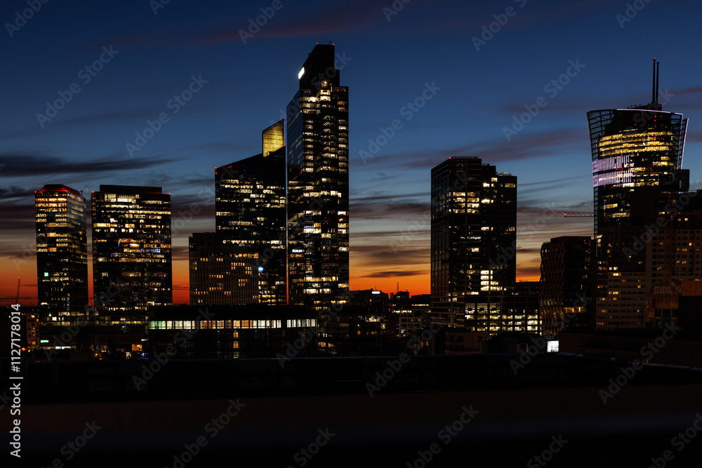 Fototapeta premium Light in skyscraper offices at sunset