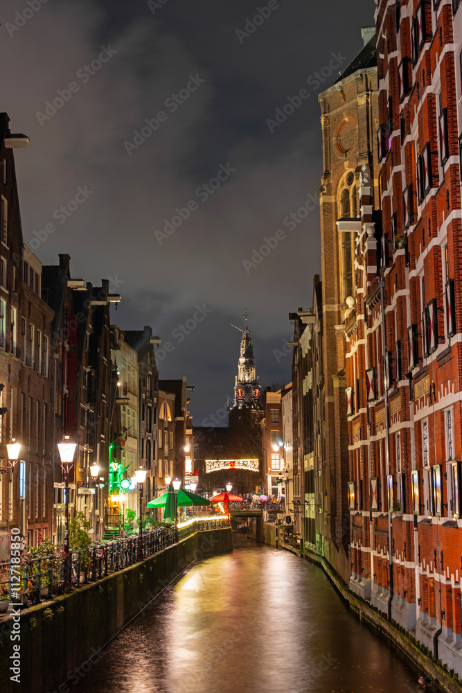 Naklejka premium City scenic from Amsterdam by night in the Netherlands