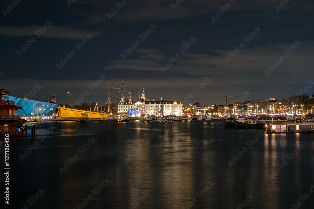 Obraz premium Amsterdam by night with the maritime museum in the Netherlands