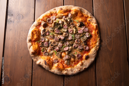 Pizza alla boscaiola condita con salsiccia di maiale e funghi porcini, cibo italiano  photo