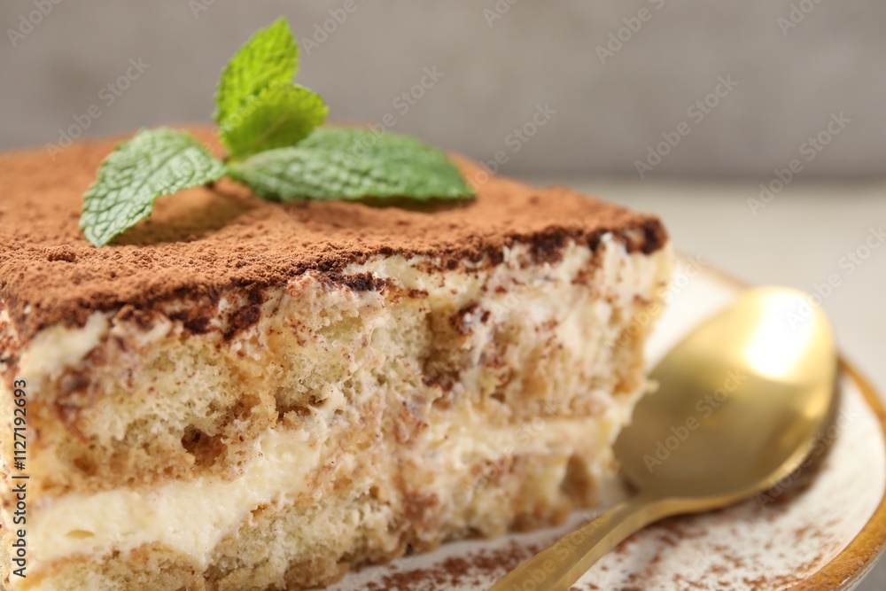 Piece of tasty tiramisu on table, closeup Piece of tasty tiramisu on table, closeup