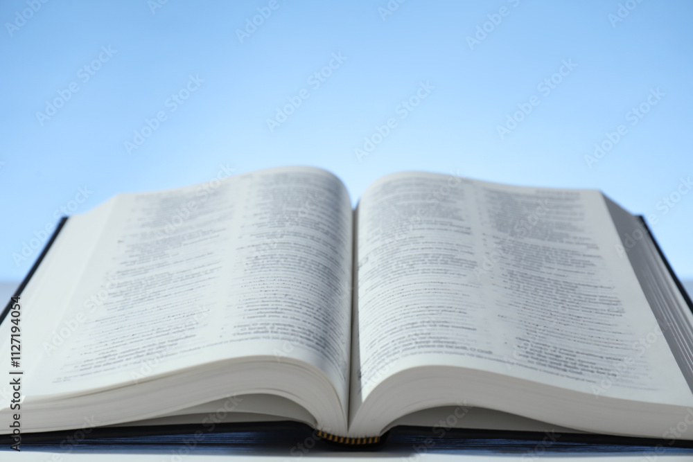 Open Holy Bible in English language on table, closeup. Space for text Open Holy Bible in English language on table, closeup. Space for text