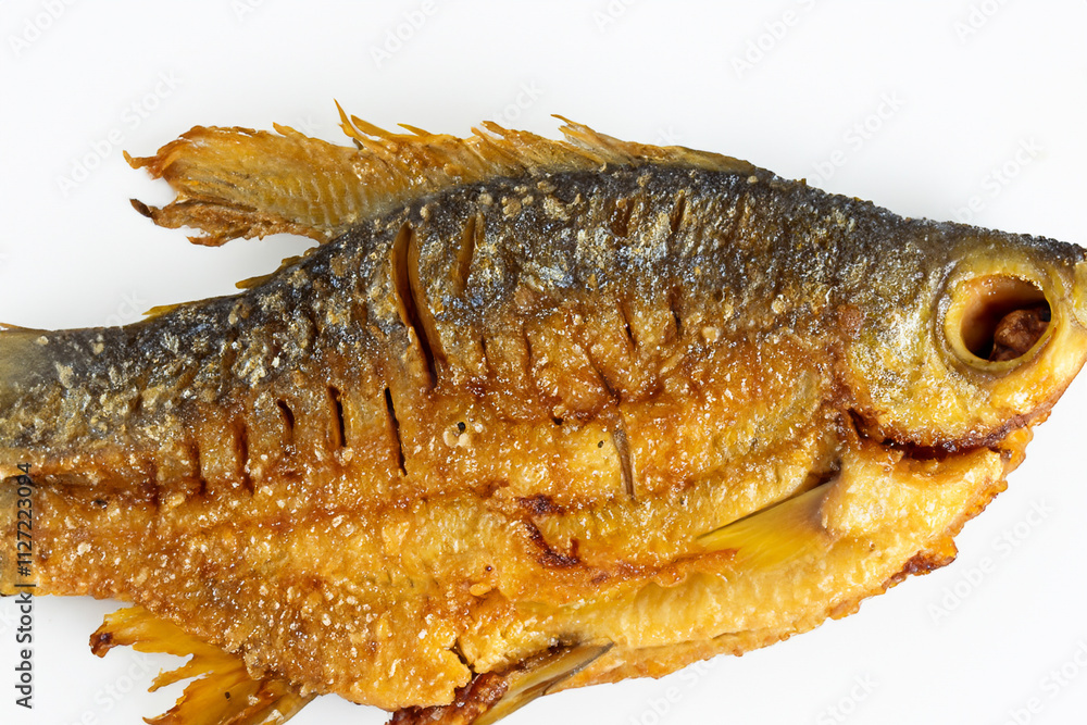 Fish that has been cooked on surface. Fried white fish on white background. Crucian background with white fried carp lying on a rocky surface. A fried fish with a white background lies lifestyle on a. Fish that has been cooked on surface. Fried white fish on white background. Crucian background with white fried carp lying on a rocky surface. A fried fish with a white background lies lifestyle on a.