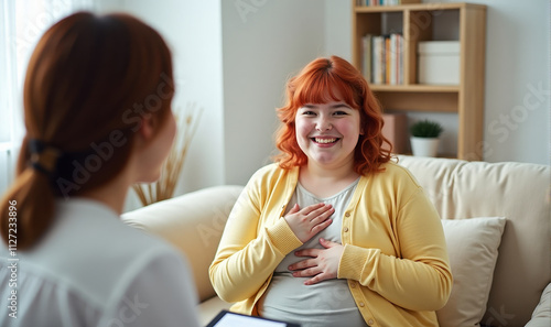 joyful plump girl with red hair in a yellow jacket, appointment with a doctor or psychologist
