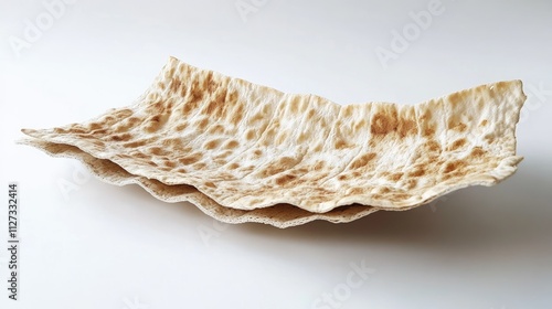 Matzo bread stacked on a neutral background traditional Jewish celebration food for Passover and cultural significance in rituals photo