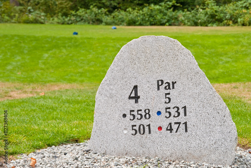 Golf hole sign and teeing area.