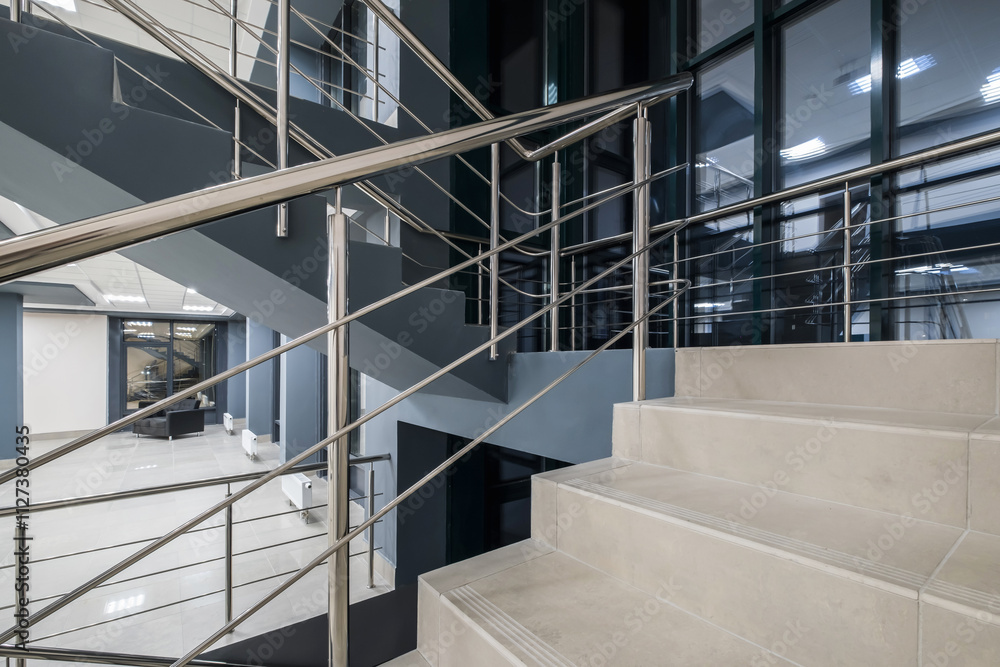 stairs emergency and evacuation exit stair in up ladder in a new office building at night stairs emergency and evacuation exit stair in up ladder in a new office building at night
