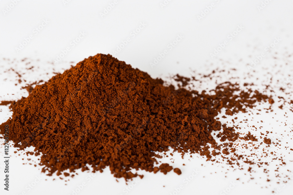 Pile of brown powder on surface. White coffee with powder on white background. Handful of coffee and a handful of powder lying on a white background. A handful of coffee powder lies on a lifestyle. Pile of brown powder on surface. White coffee with powder on white background. Handful of coffee and a handful of powder lying on a white background. A handful of coffee powder lies on a lifestyle.