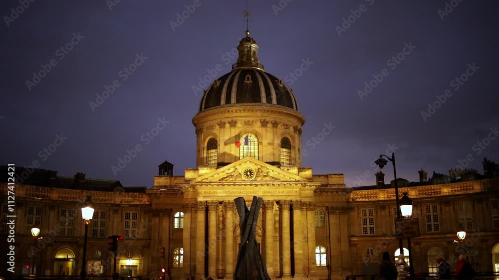French Institute at night, with flag of France, with a blurred beginning French Institute at night, with flag of France, with a blurred beginning