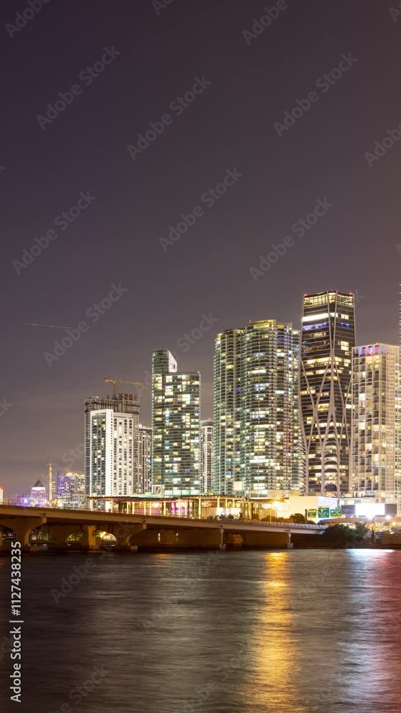 Twilight time lapse of Biscayne Bay and the tall buildings of the Miami skyline. Miami Florida. Vertical Video. Twilight time lapse of Biscayne Bay and the tall buildings of the Miami skyline. Miami Florida. Vertical Video.