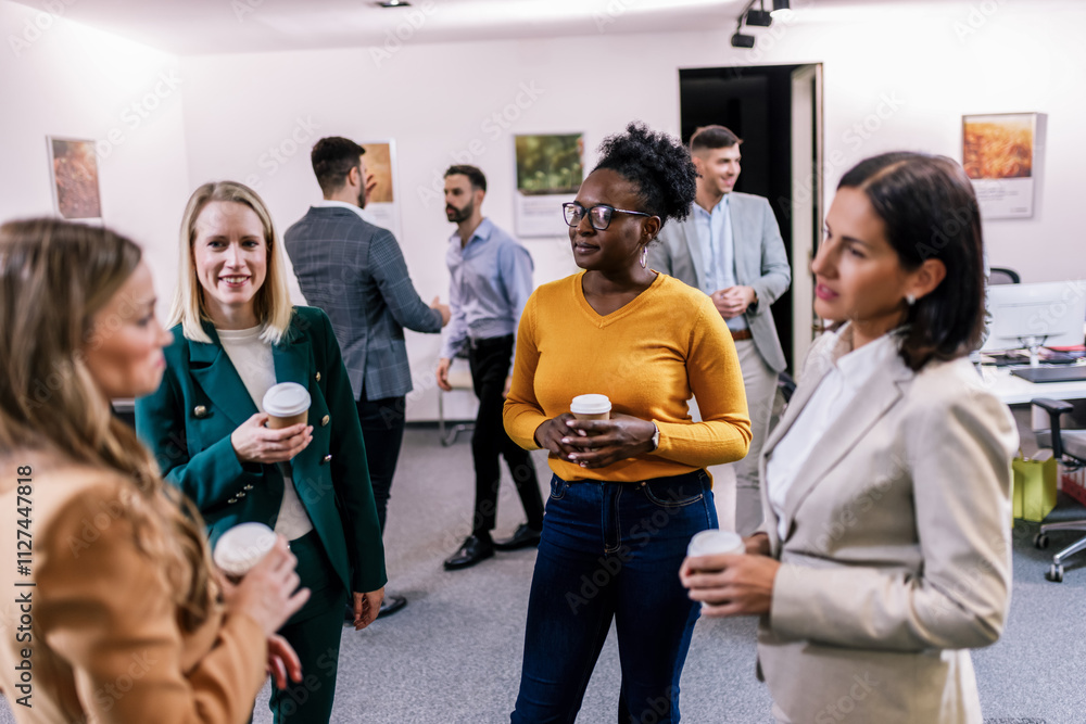 © Mediteraneo - Business people on a coffee break during a seminar.