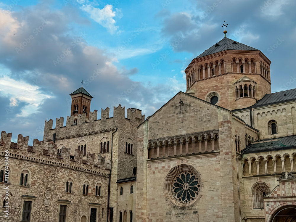Impressive facade of the Trento Cathedral in city of Trento, Trentino Alto Adige, Italy. Architecture is blend of Romanesque and Gothic styles, with series of arches adorning the entrance. Sightseeing Impressive facade of the Trento Cathedral in city of Trento, Trentino Alto Adige, Italy. Architecture is blend of Romanesque and Gothic styles, with series of arches adorning the entrance. Sightseeing
