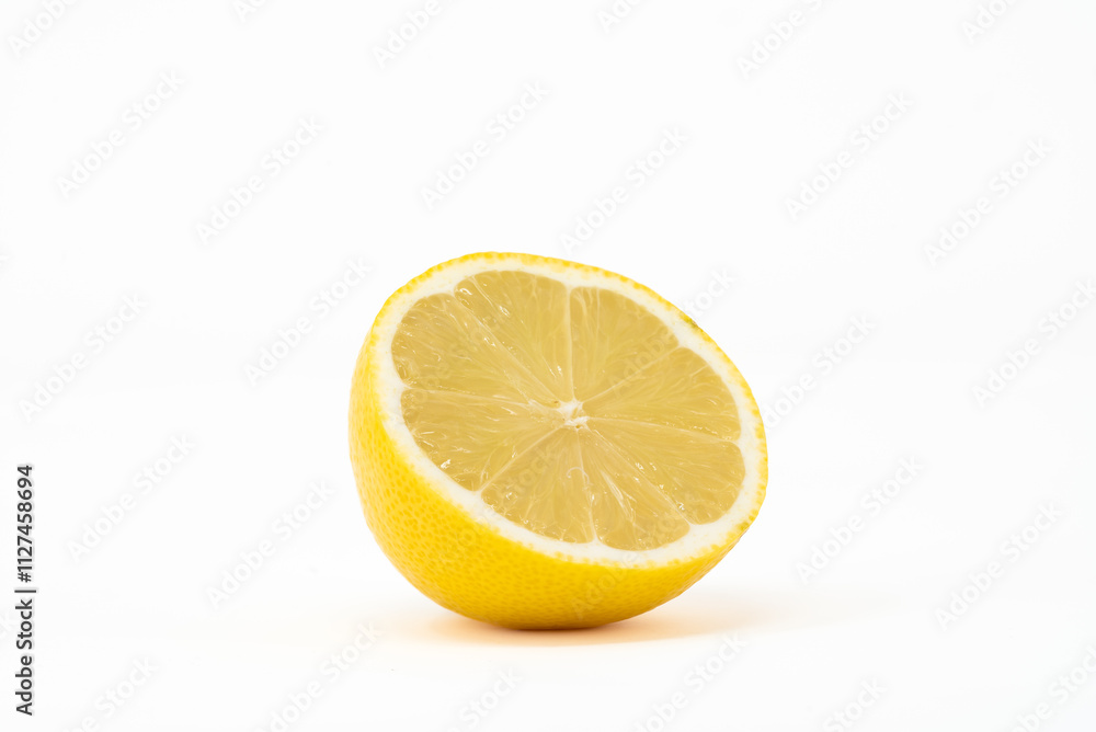 A vibrant, juicy lemon captured in front view, showcasing its bright yellow color and detailed A vibrant, juicy lemon captured in front view, showcasing its bright yellow color and detailed