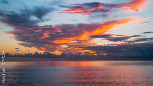 A vivid sunset over a calm ocean