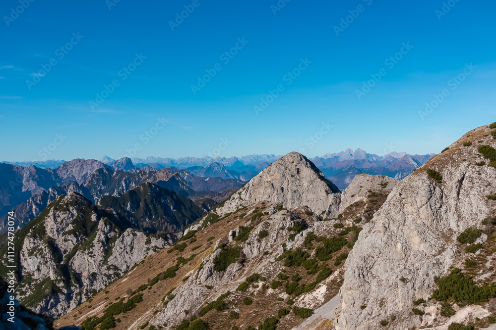 Summit of mount Due Pizzi Cima Alta surrounded by rugged mountain peaks of Dolomites, Carnic Alps and Julian Alps. Hiking trail to mount Piper in Friuli Venezia Giulia, Italy. Wanderlust Italian Alps Summit of mount Due Pizzi Cima Alta surrounded by rugged mountain peaks of Dolomites, Carnic Alps and Julian Alps. Hiking trail to mount Piper in Friuli Venezia Giulia, Italy. Wanderlust Italian Alps