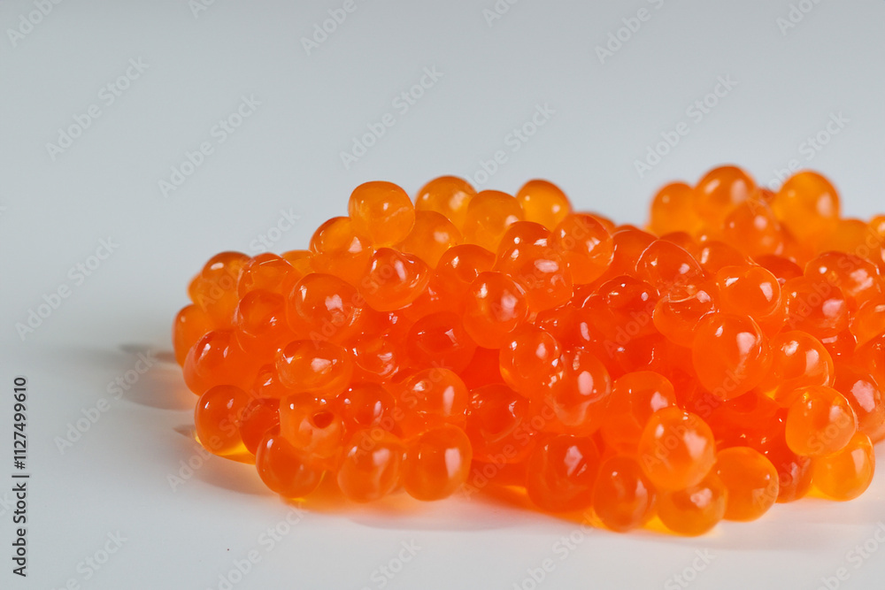 Orange caviar on white plate. Scuba diver in the background of orange caviar. A handful of gray caviar lies on a gray background. A handful of gray fish lies on a green background lifestyle with. Orange caviar on white plate. Scuba diver in the background of orange caviar. A handful of gray caviar lies on a gray background. A handful of gray fish lies on a green background lifestyle with.