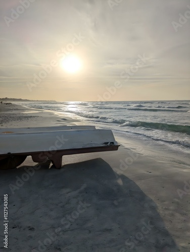 Boat Upside Down on the beach during sunset