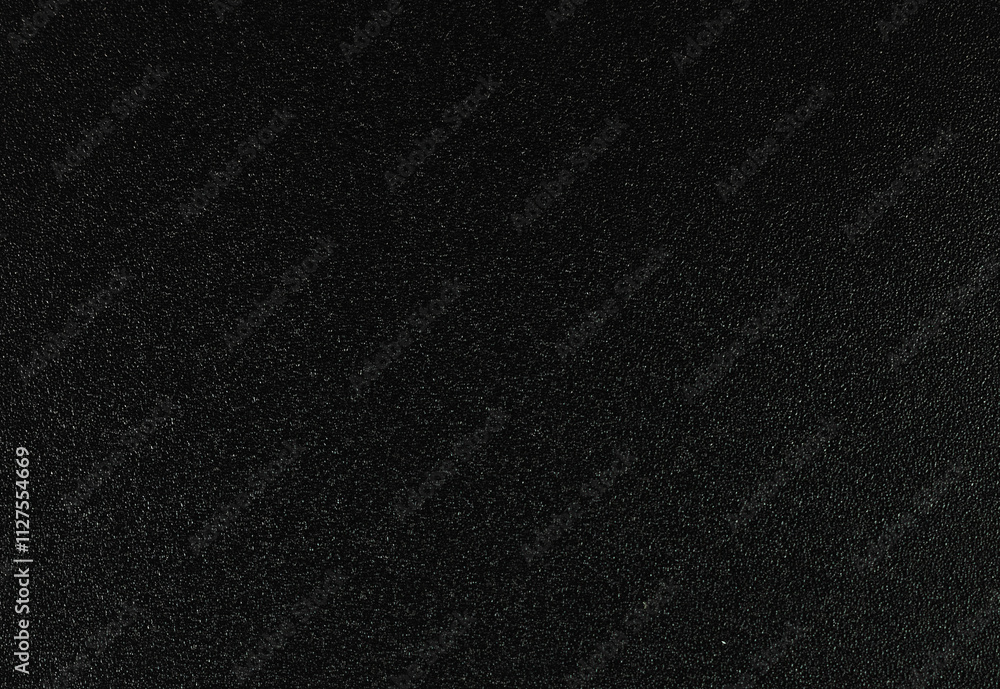 Fototapeta premium Background of plastic texture in black with small dots
