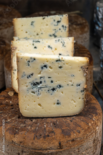 Pieces of tasty Blue Basque Fume smoked sheep cheese produced in south-western France, Northern Basque Country photo