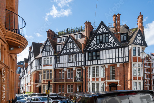 Red bricks houses on Hans Crescent street in Royal Borough of Kensington and Chelsea, London, UK