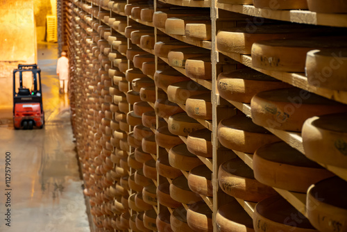 Aging rooms with shelves in cheese caves, central location for aging of wheels, rounds of Comte cheese from four months to several years made from raw cow milk, Jura, France photo