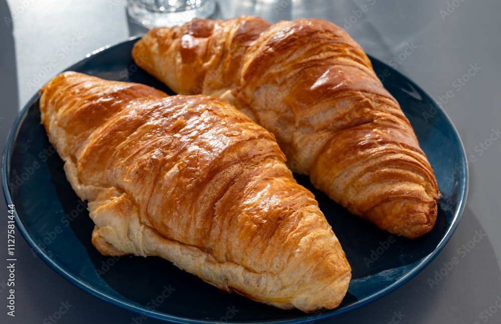 Fresh baked buttered croissants served in restaurant for continental or French breakfast close up Fresh baked buttered croissants served in restaurant for continental or French breakfast close up