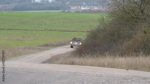 British army Bulldog FV434 on a test training run along a dirt road