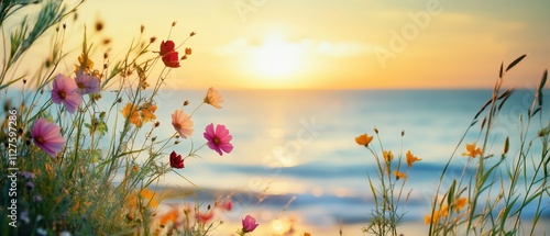 Flowers framing a defocused seaside background on a sunny evening