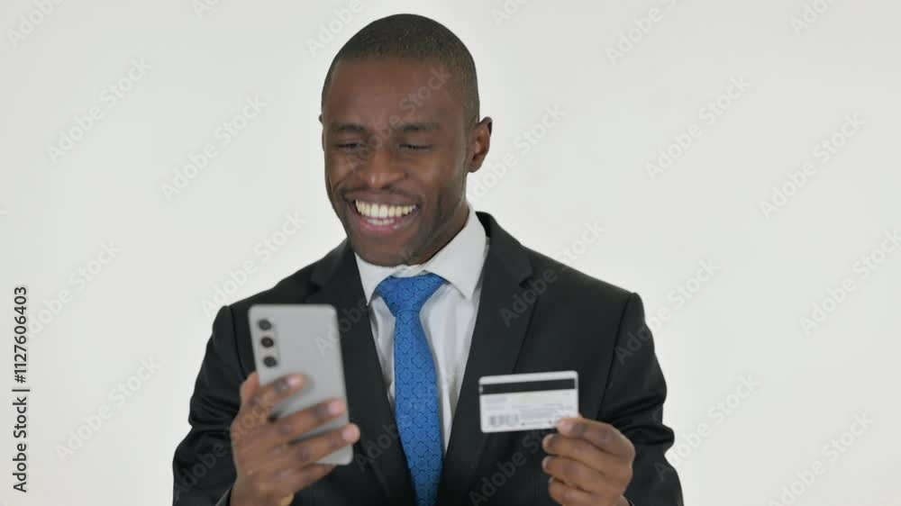 Portrait of African Businessman Enjoying Online Shopping on White Background Portrait of African Businessman Enjoying Online Shopping on White Background