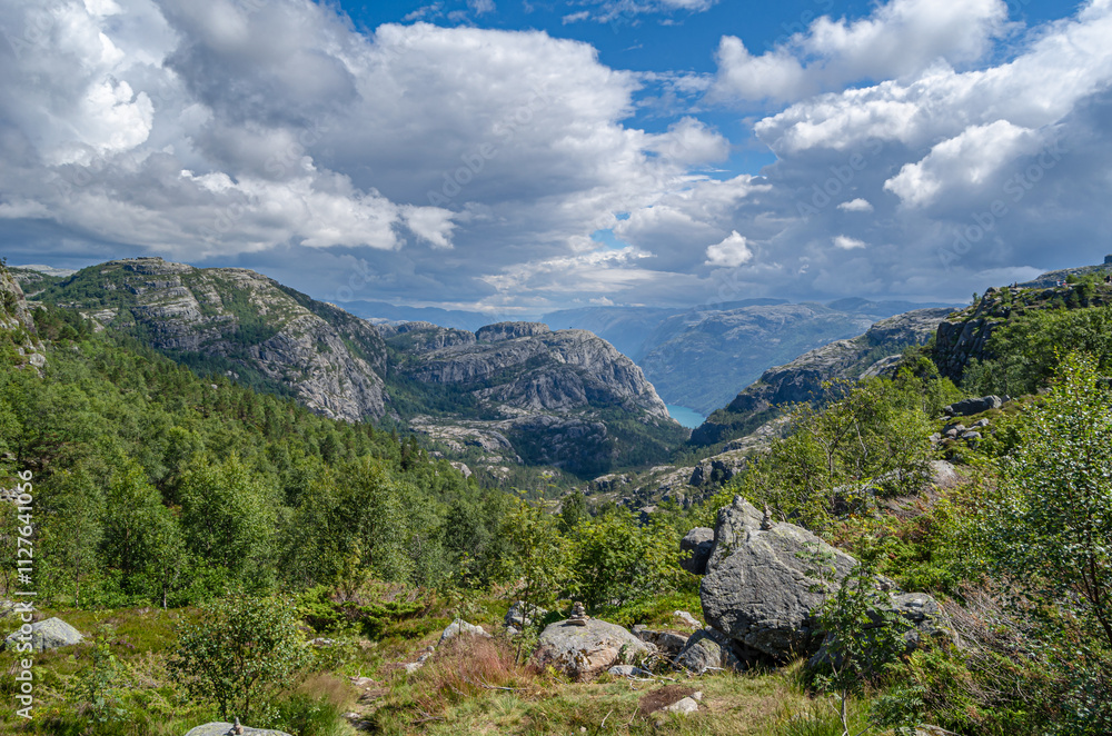 Rock formations on the route to Preikestolen (The Pulpit Rock), a tourist attraction in Rogaland county, Norway Rock formations on the route to Preikestolen (The Pulpit Rock), a tourist attraction in Rogaland county, Norway