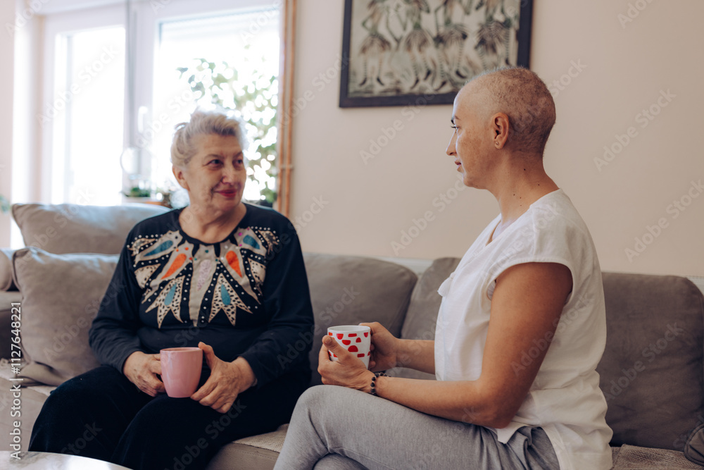 Obraz premium Woman with cancer support. Two friends share a serene conversation over coffee, capturing the essence of friendship and emotional bonding in a cozy, inviting atmosphere.