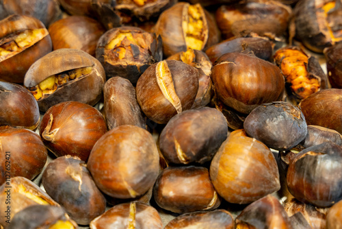 Close-up with out of focus background of typical Christmas roasted chestnuts. photo