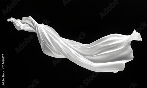 White paper flying, sheet falls and twists isolated on black, clipping path photo