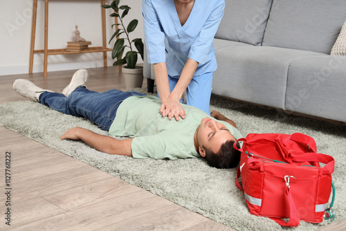 Female doctor doing CPR on ...