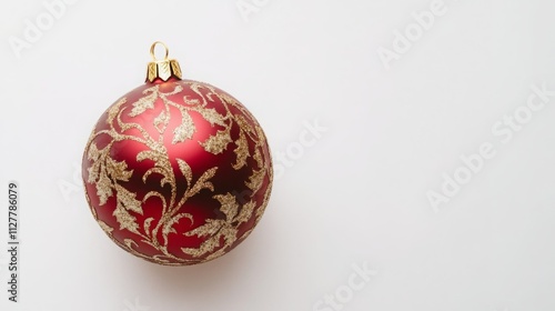 Red Christmas ornament with gold detailing on a white background.